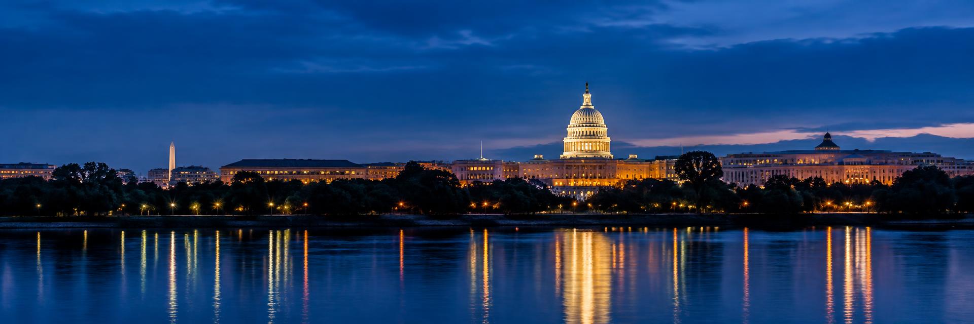 The U.S. Capitol dome at dusk seen across the Potomac River